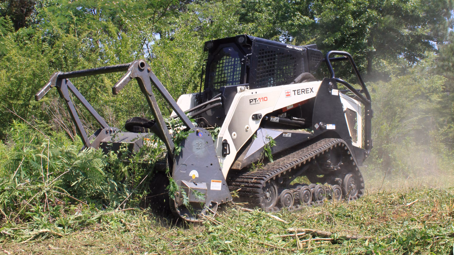 forestry mulching machine clearing thick brush on a Shreveport LA property