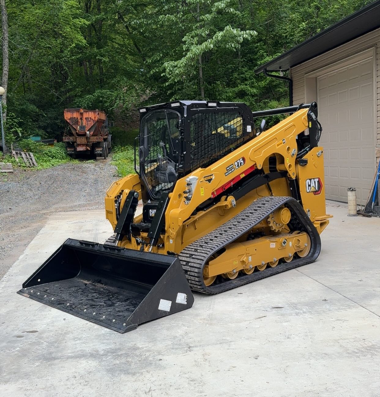 Skilled excavation crew checking grade levels and slope alignment with site equipment