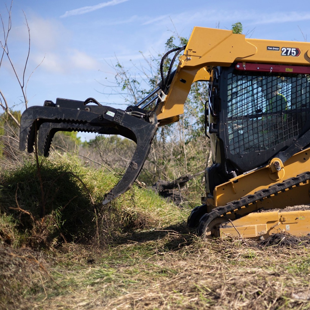 Experienced cleanup team assessing storm hazards and removing dangerous debris safely